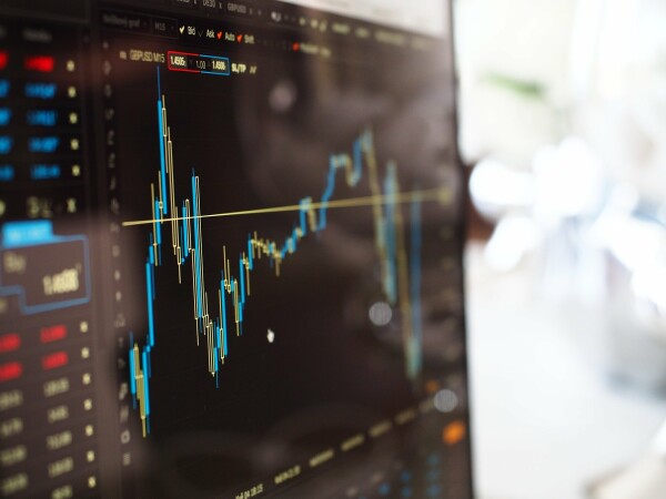 crypto price chart on a laptop
