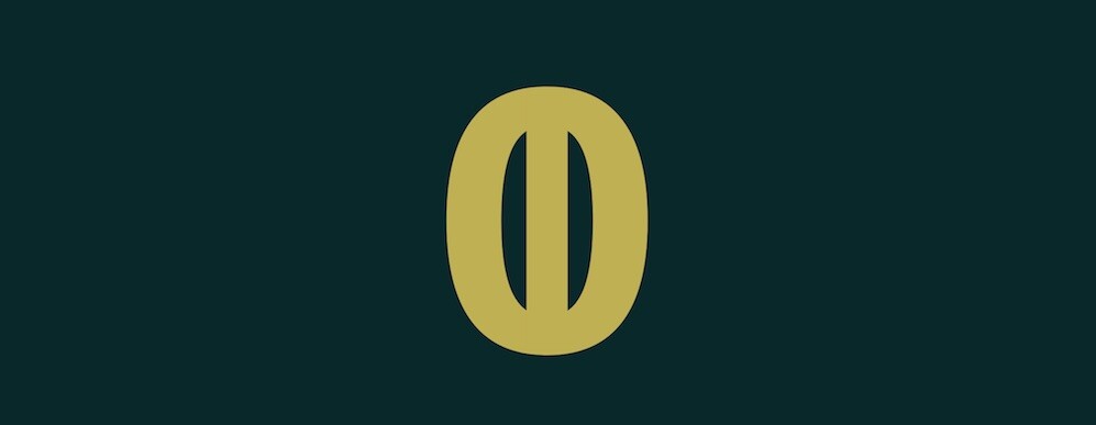 zero with a one through it in gold text with black background