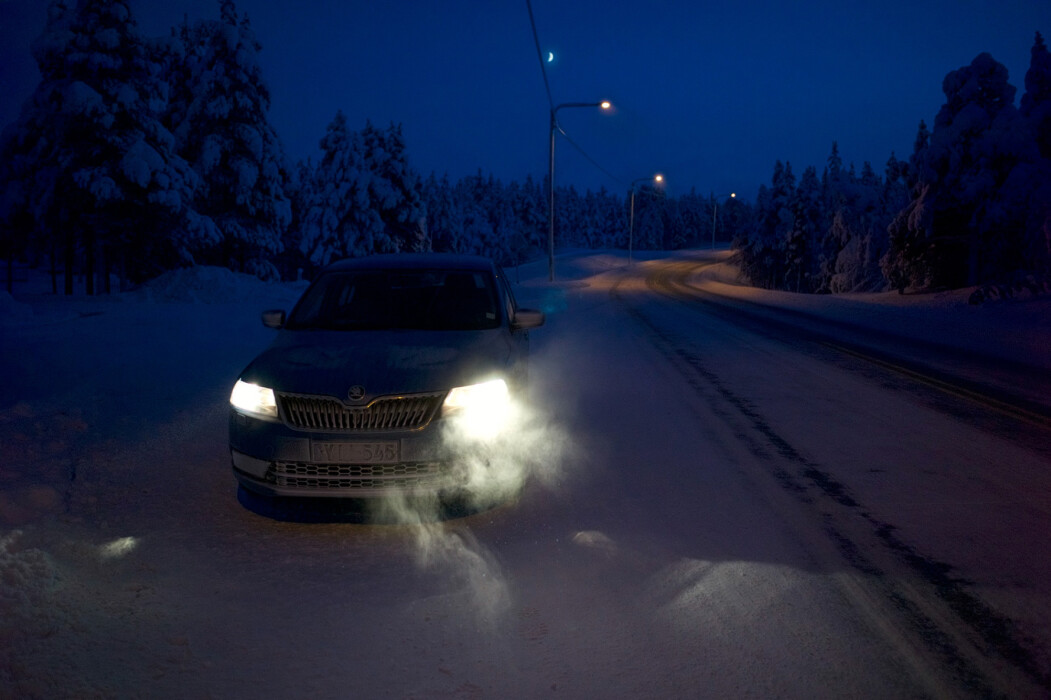 Driving in the winter night across arctic circle