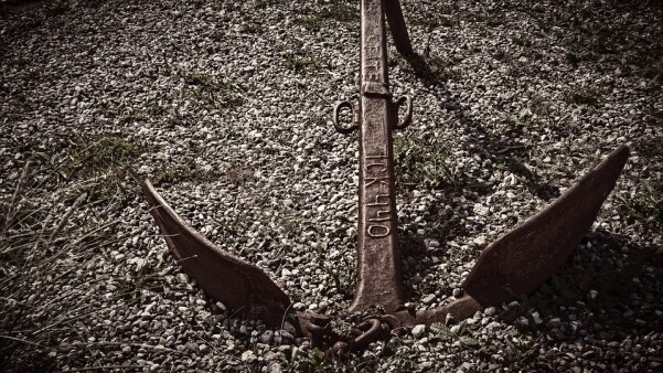 anchoring bias in cryptocurrency trading represented by a rusty anchor