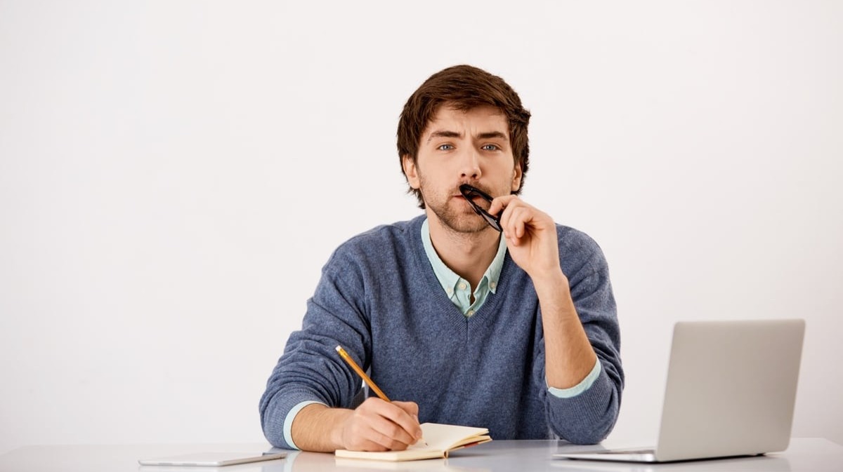 Man on laptop thinking if Content Marketing Effective In Increasing Sale