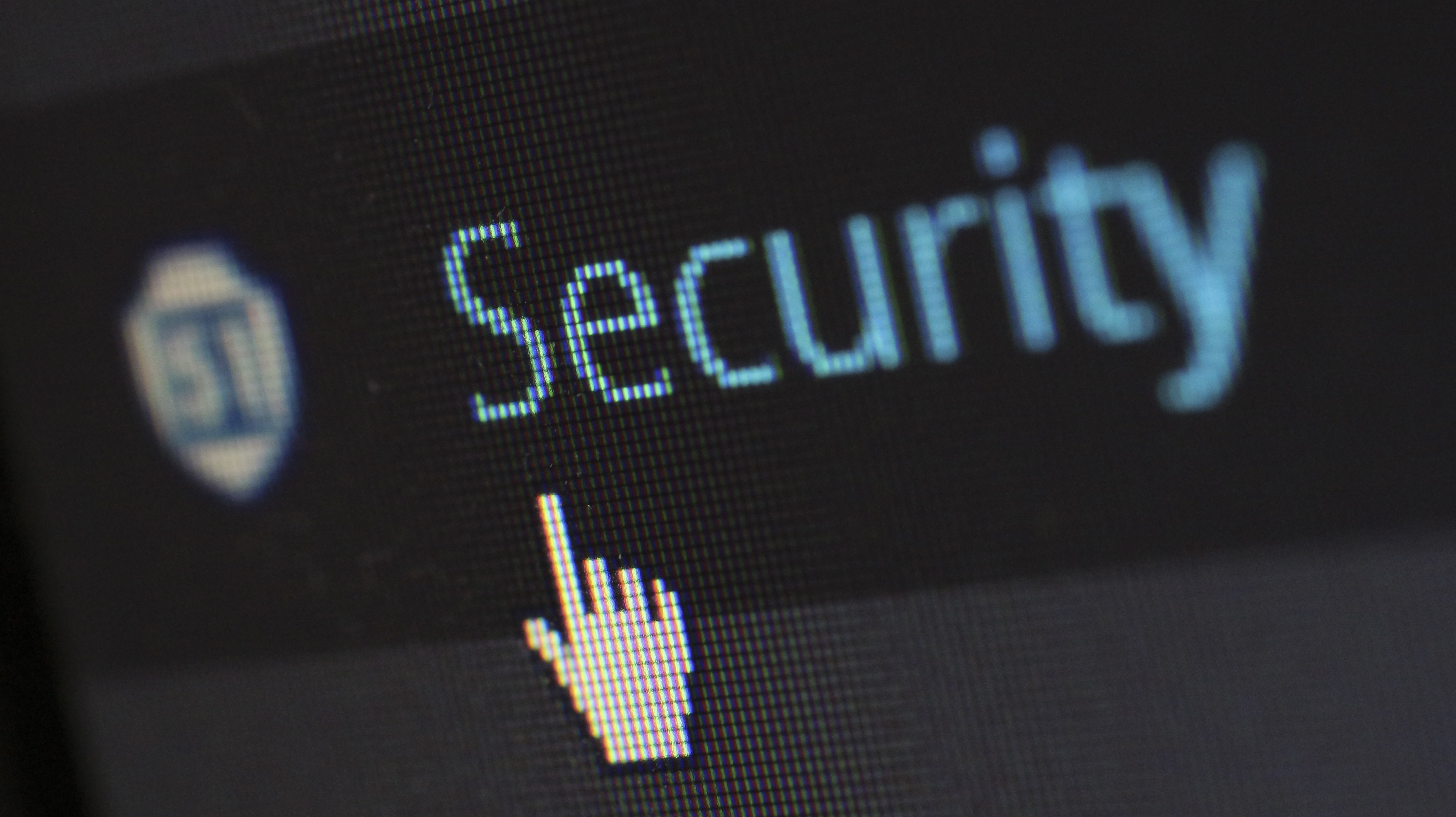 Computer pointer hovering over a text that spells "Security"