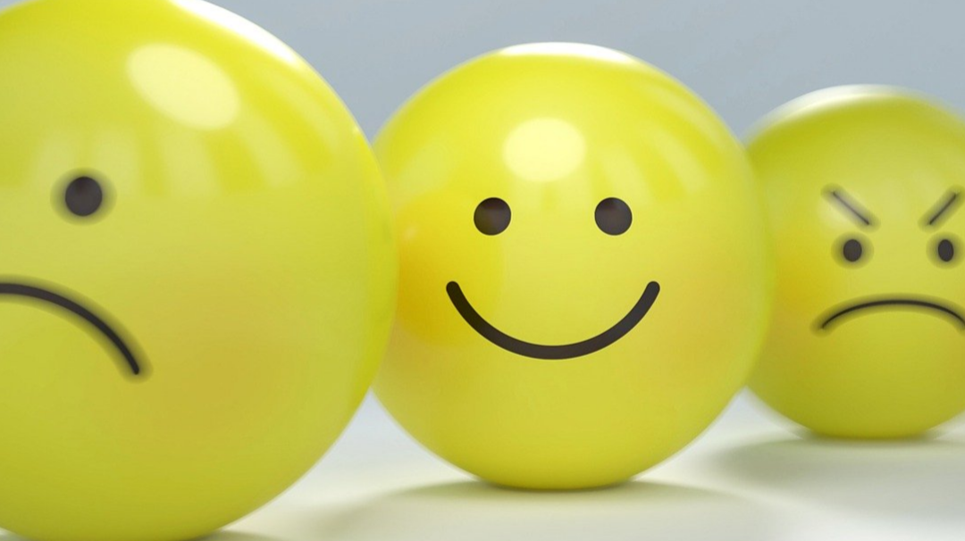 Happy face on yellow ball