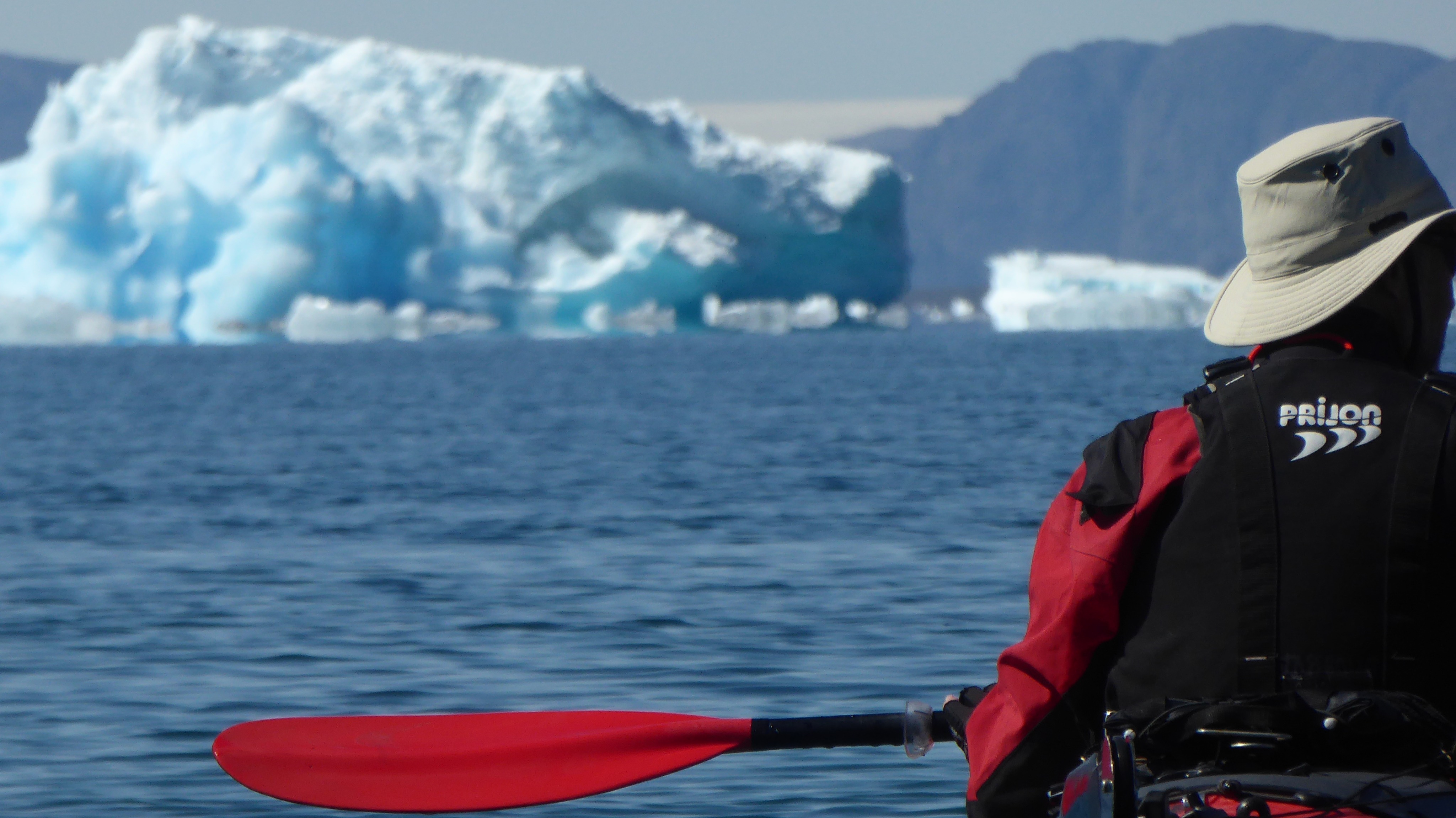 Kayak and iceberg