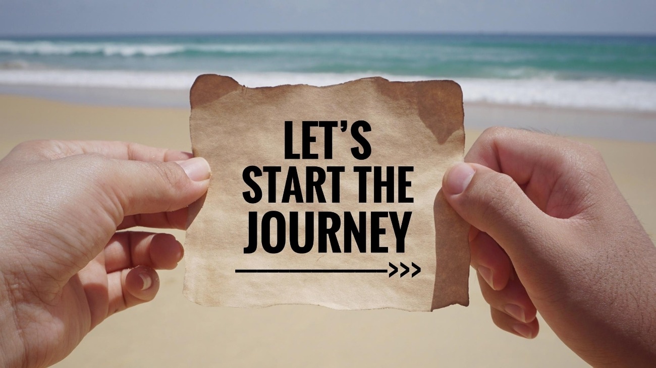 sign with arrow Let's Start The Journey
