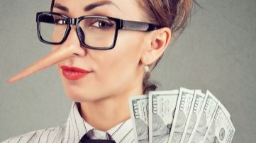 lying business woman with Pinnochio nose holding money