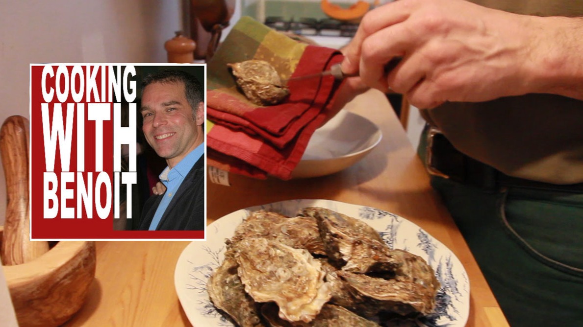 Benoit shucking an oyster