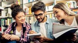 Students at a library looking at their notes