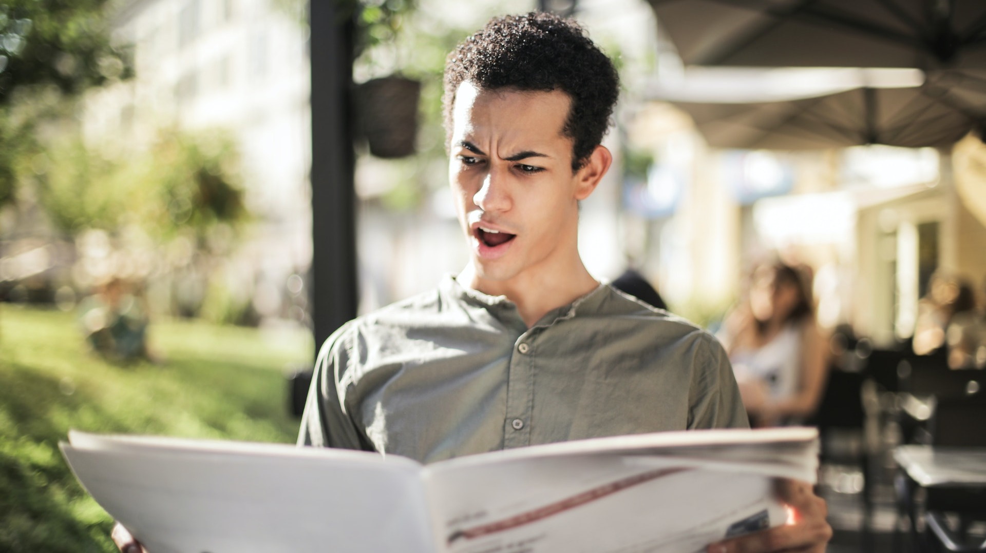 https://www.pexels.com/photo/selective-focus-photo-of-surprised-man-in-green-button-up-shirt-reading-newspaper-3765037/