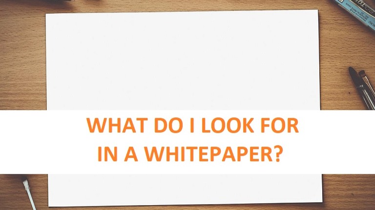 Picture of a white paper, text asking what do I look for in a whitepaper?