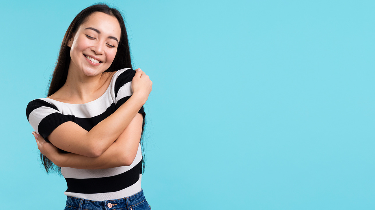 Girl hugging herself