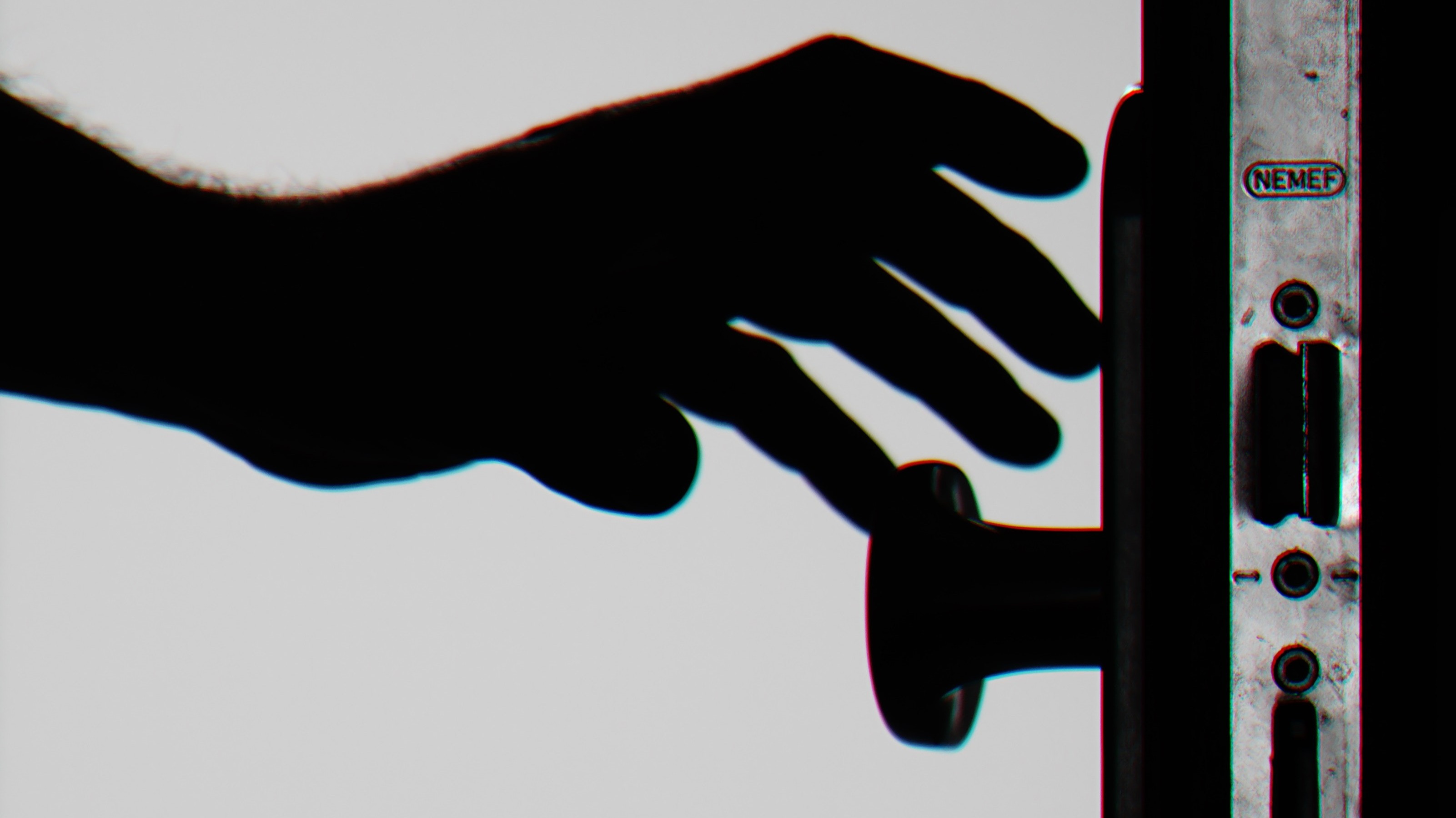 https://www.pexels.com/photo/silhouette-photo-of-person-holding-door-knob-792032/