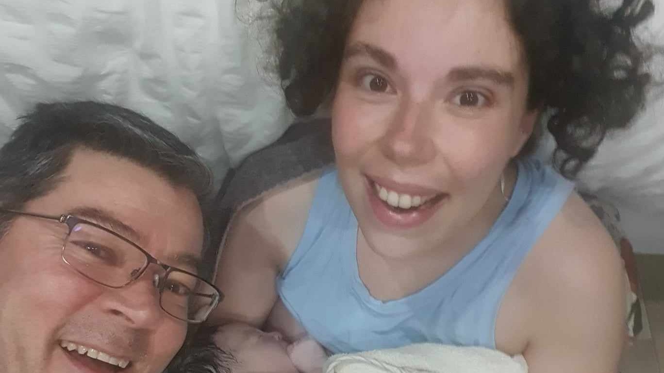 The moment just before the paramedics arrived, shortly after we delivered our baby, ourselves in our caravan.
