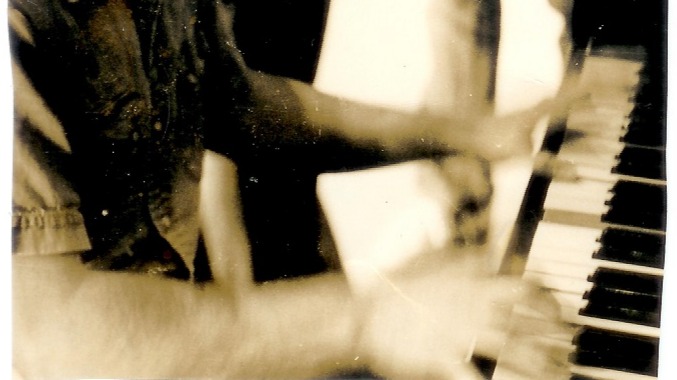 One of the oldest photos of me playing piano, from possibly my junior year in High School