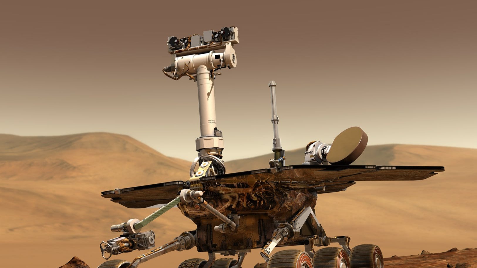 A grey and white rover on the Martian surface with mountains in the background.