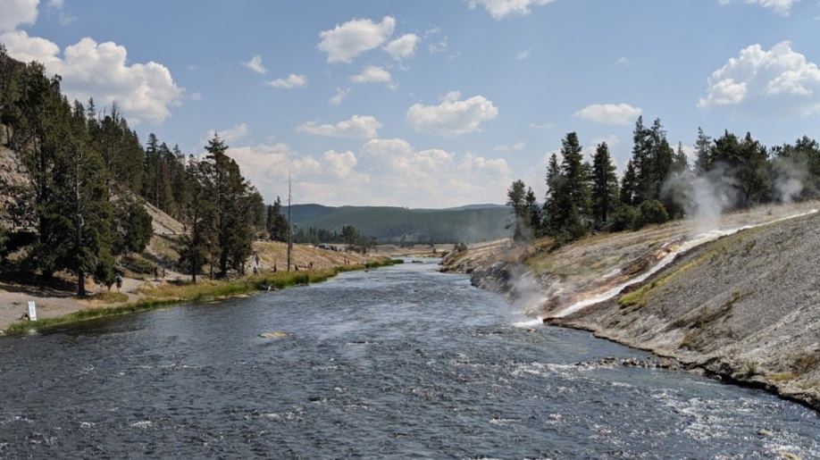 On a bridge across the Firehole River near Midway.