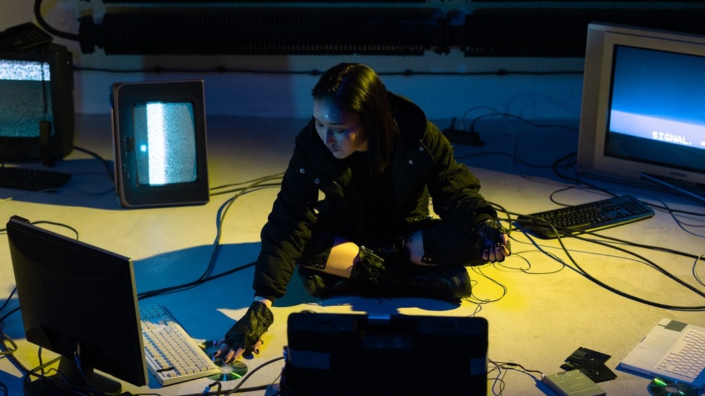 Hacker with different laptops