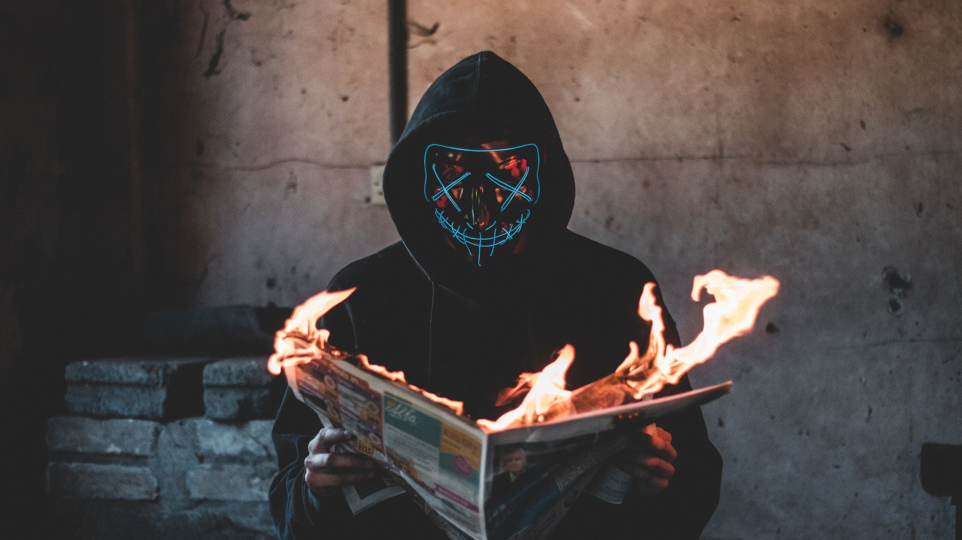 https://www.pexels.com/photo/person-holding-a-burning-news-paper-close-up-photography-2538122/
