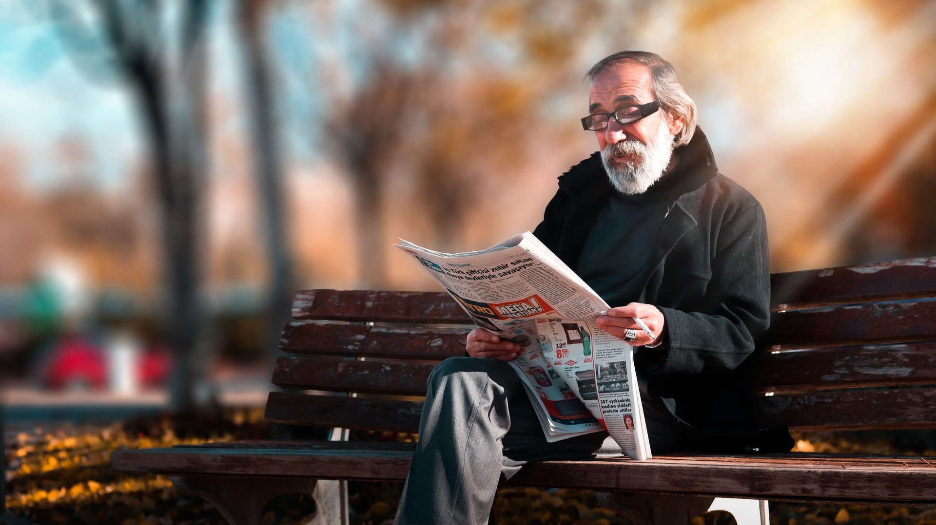 https://www.pexels.com/photo/photo-of-man-reading-newspaper-1652340/