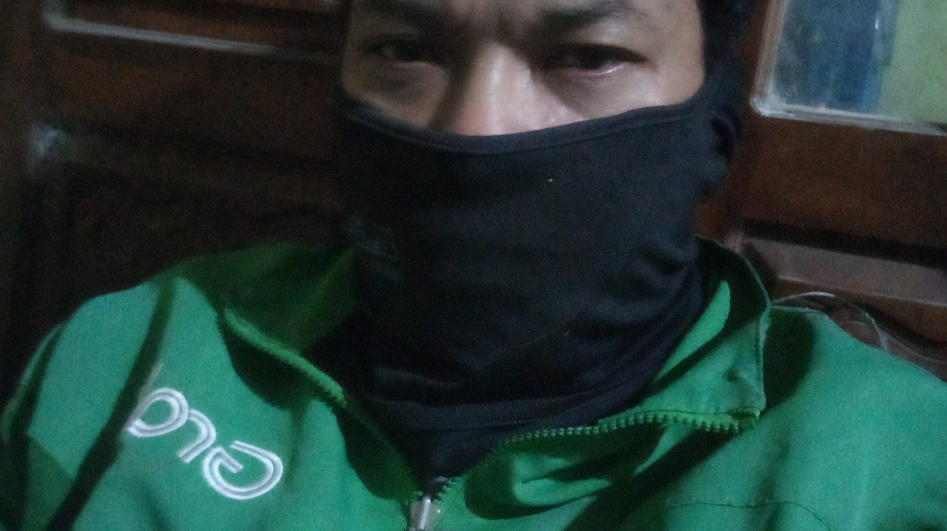 clad in my green ride-hailing uniform